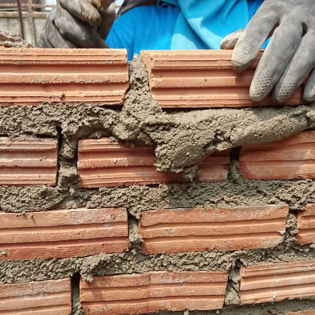 Construction process mason work with brick installation Construction process mason work with brick installation